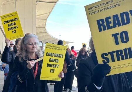 a group of people holding signs
